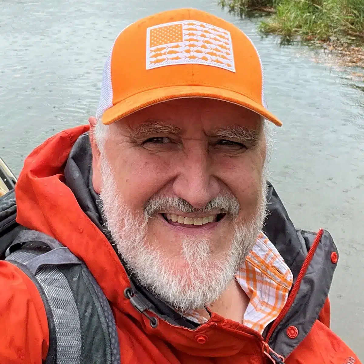 headshot photo of Gregory Alan Snyder in an orange baseball cap