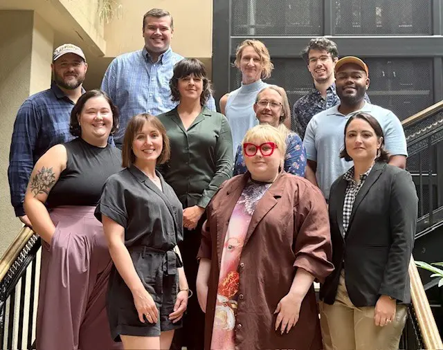 group photo of faculty fellows on stairs