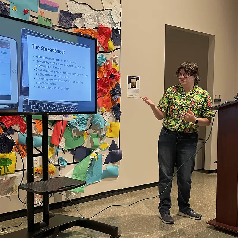 Evan Shannon discusses his curatorial internship with other interns at the McClung Museum of Natural History and Culture in spring 2024
