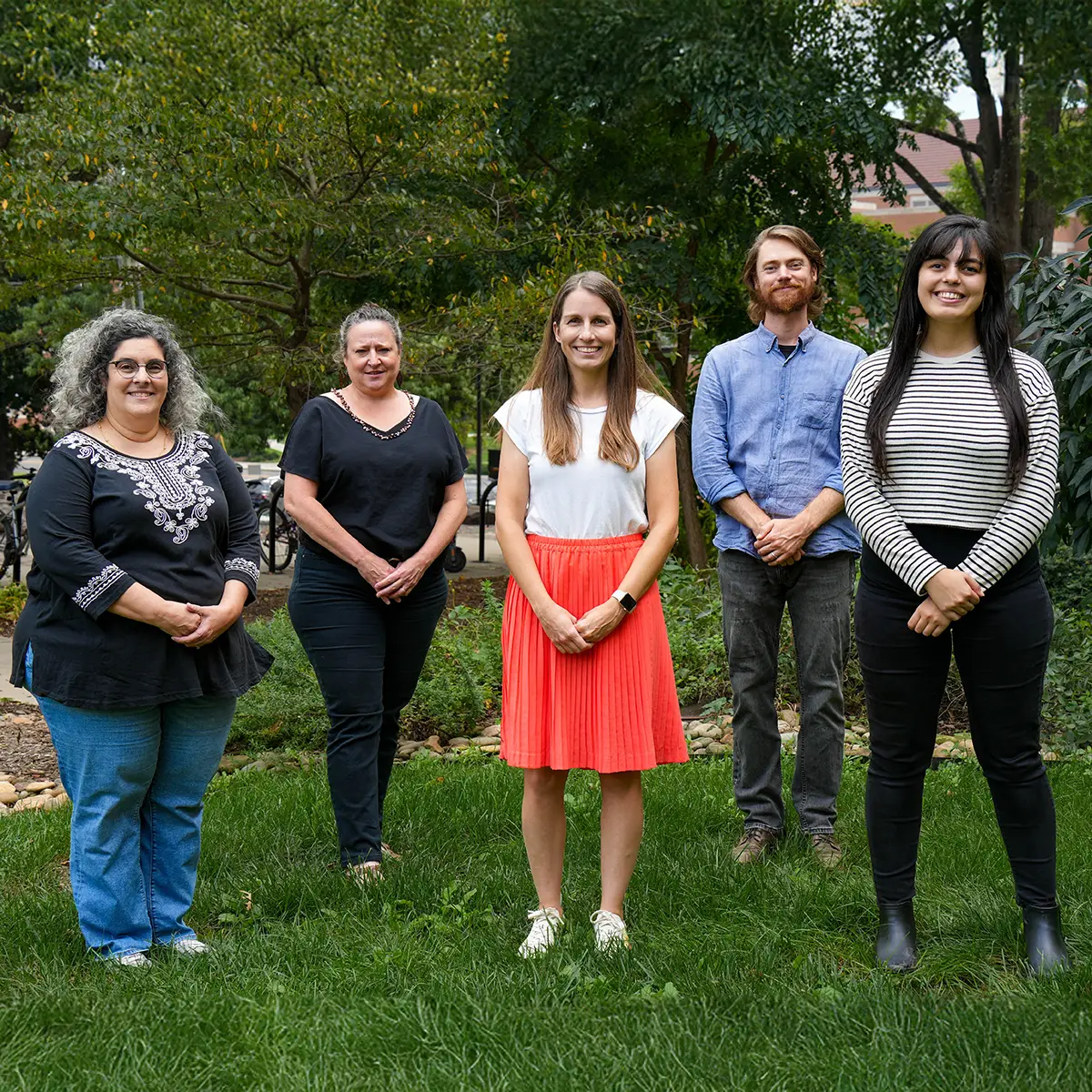 Outdoor group photo of five faculty