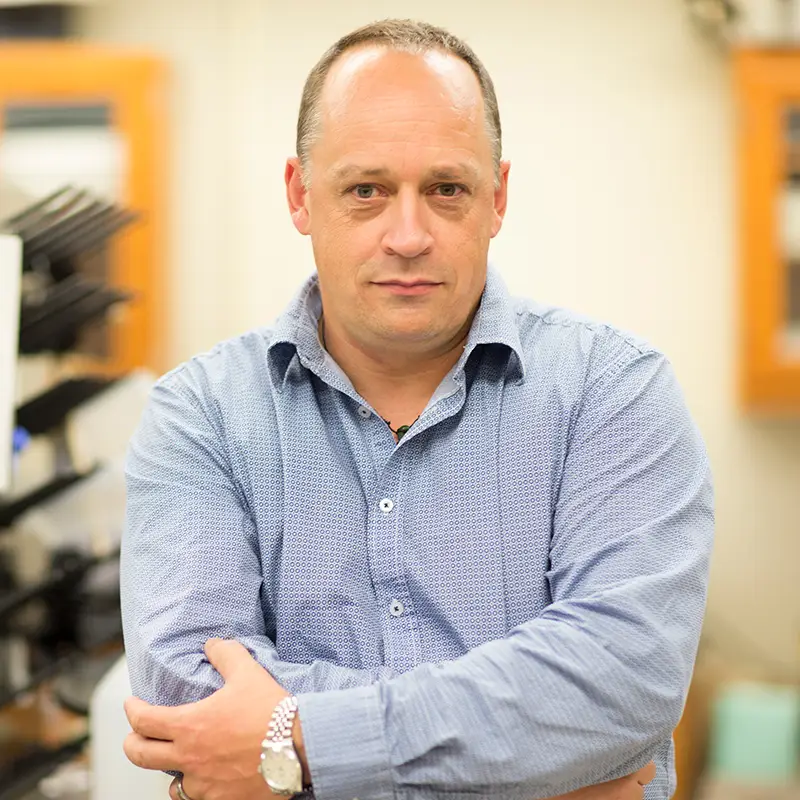 Photo of Steven Wilhelm in his lab with the background blurred