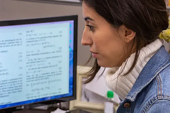 A female student working at a computer