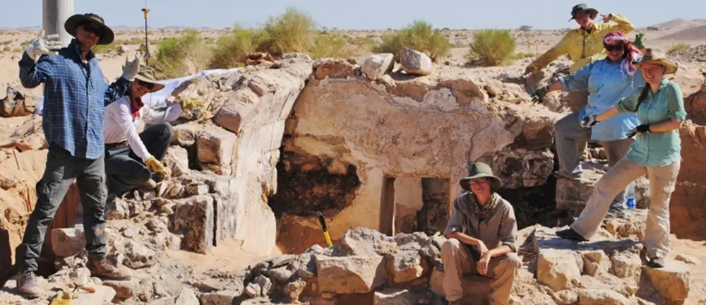 A group of researchers at a dig site