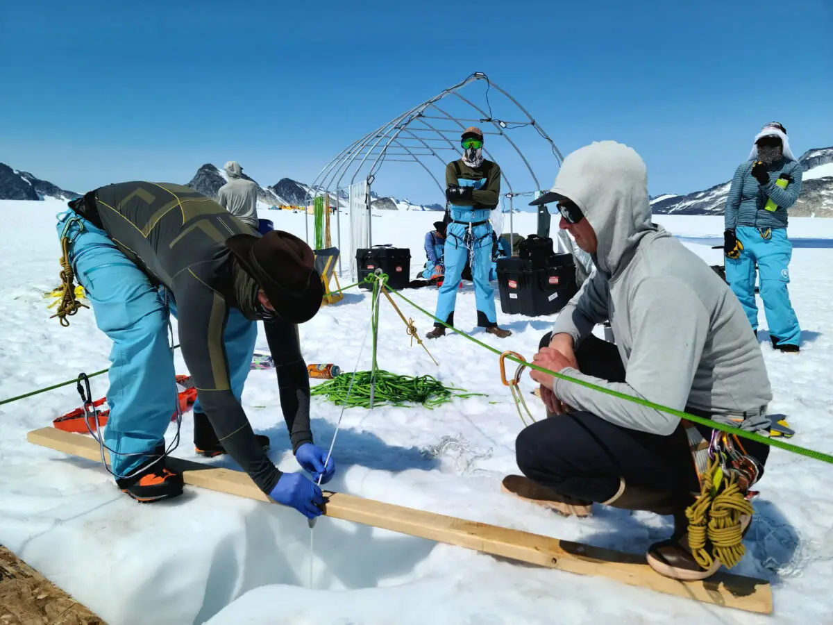 Researchers gathering samples in the snow