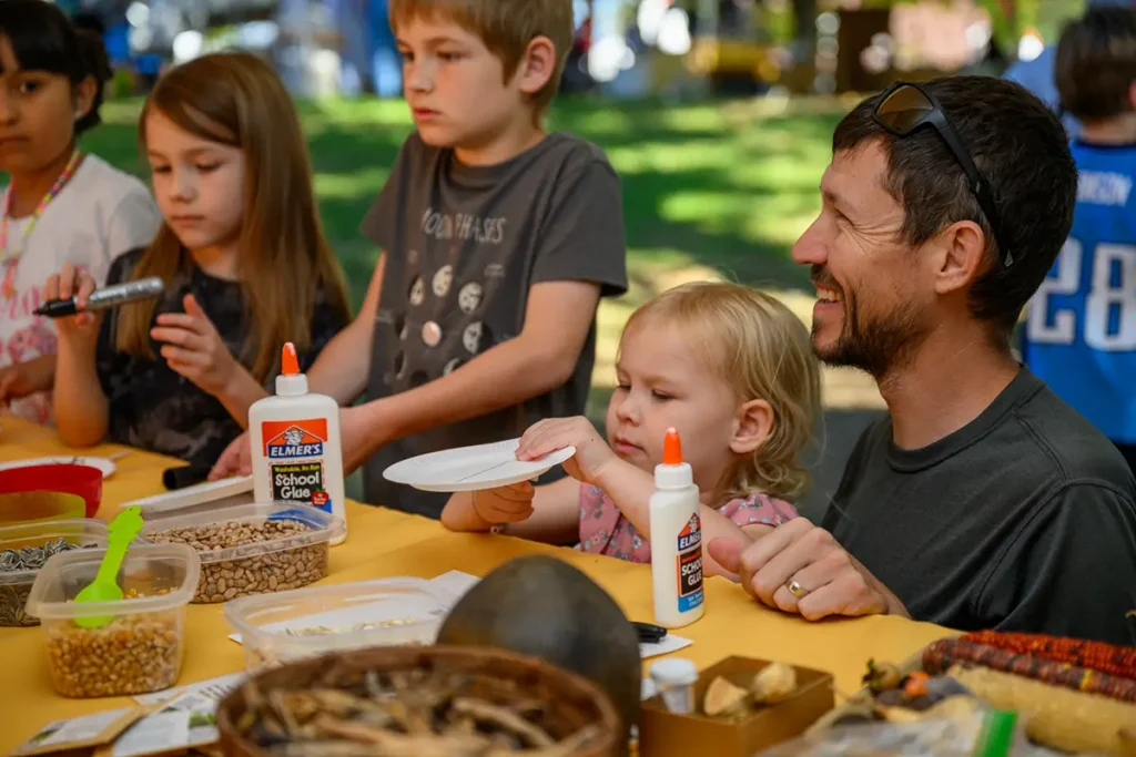 A visiting family engages in a paleoethnobotany activity during “Can You Dig It?” Photo by Grayson Photography.