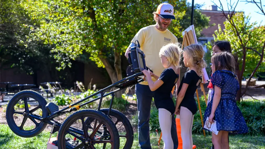 UT student William Joseph demonstrates the GPR machine for visiting students. Photo by Grayson Photography. 