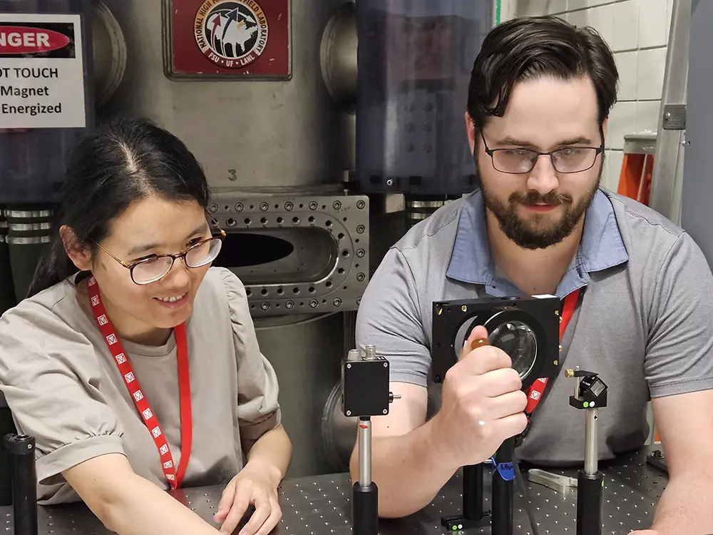 UT researchers Yanhong Gu and Kevin Smith work at the National High Magnetic Field Laboratory.