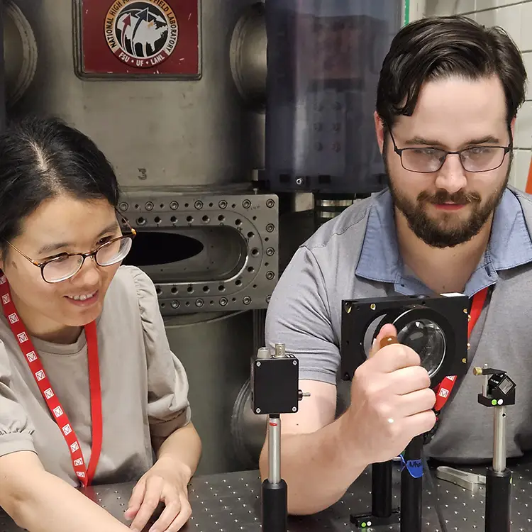 UT researchers Yanhong Gu and Kevin Smith work at the National High Magnetic Field Laboratory.