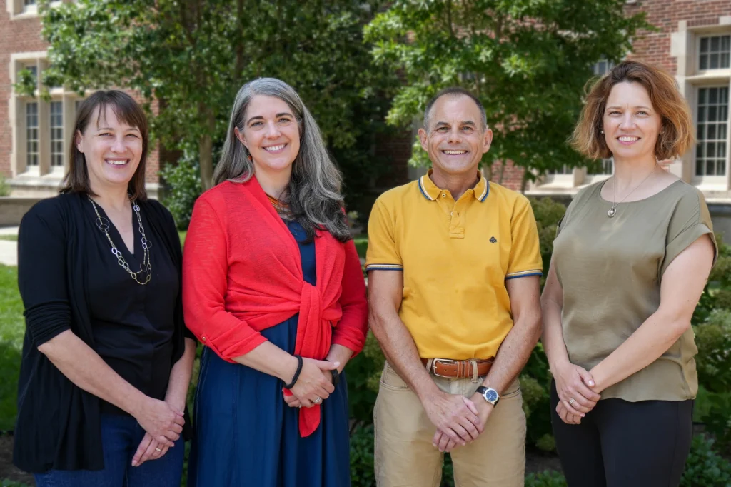 Outdoor group photo with three women and one man