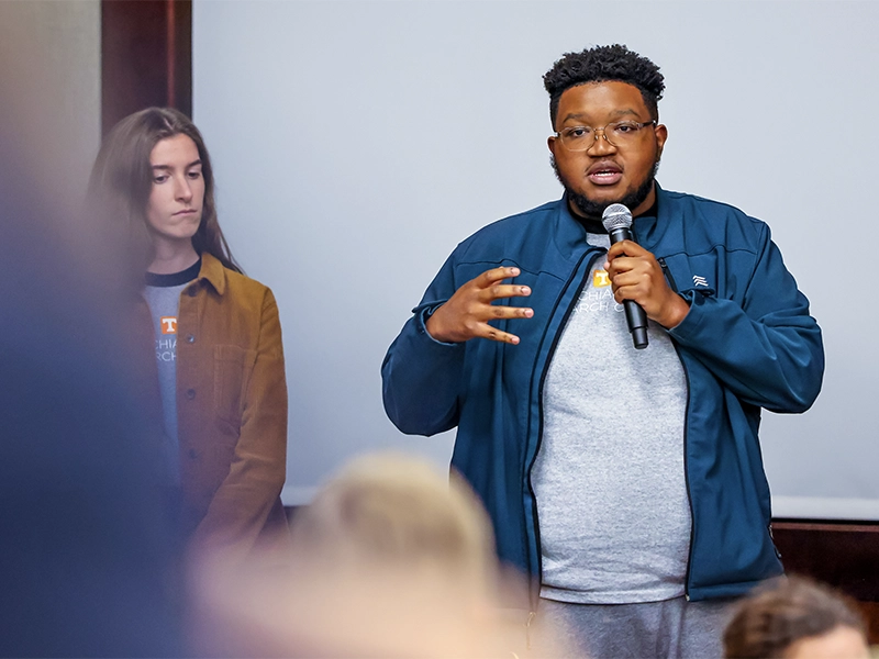 A male student making a presentation