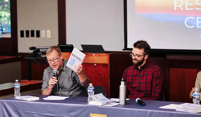 Two speakers on a panel discussion