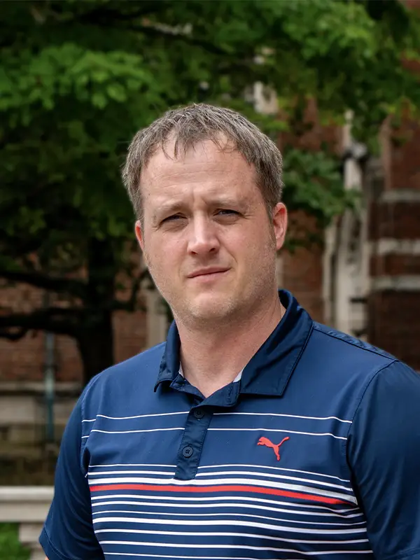 Outdoor headshot photo of a man