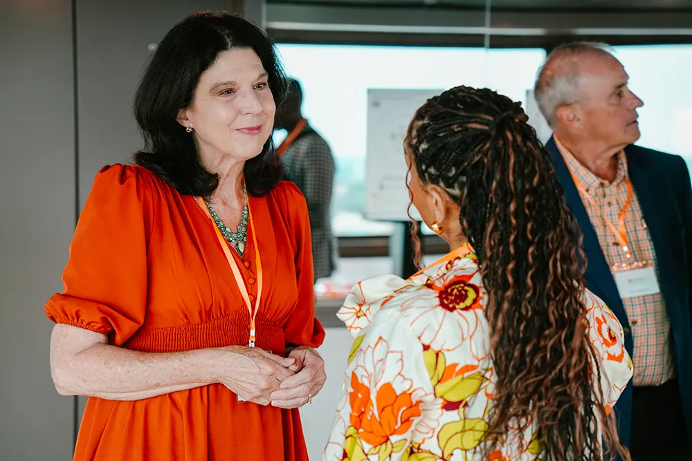 Two women conversing at the 2025 Alumni Awards 
