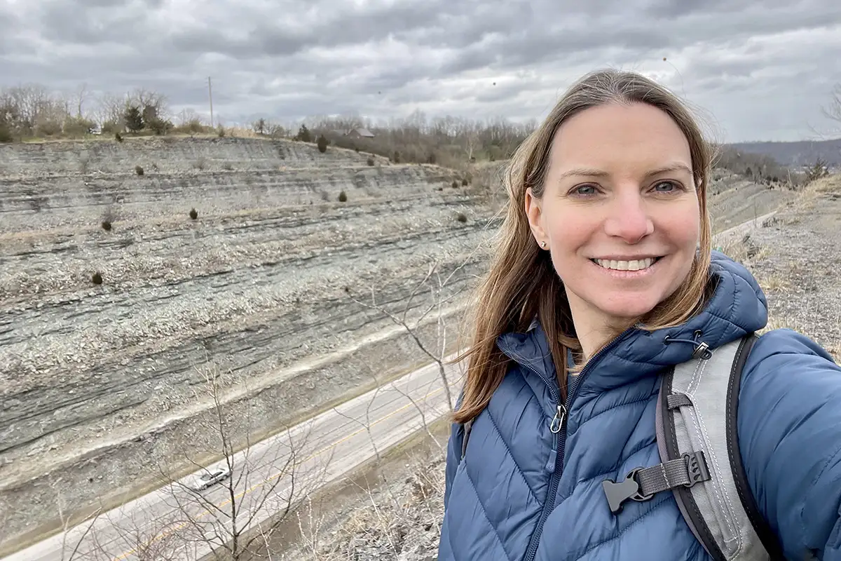 Alycia Stigall in front of a canyon of rocks 