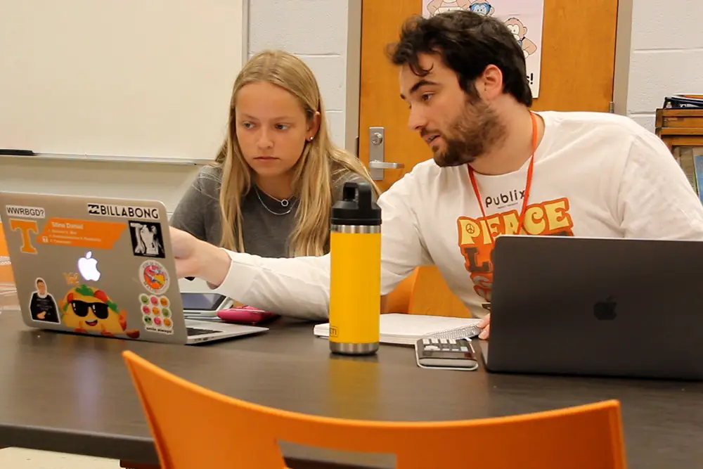 A student tutor in the Chemistry Learning Center tutors a first-year student.