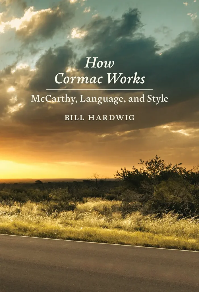 A book cover of a sunset near the road titled, "How Cormac Works: McCarthy Language and Style" by Bill Hardwig. 