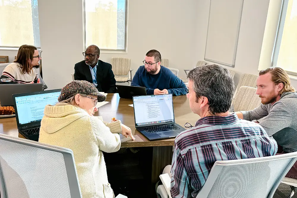 CATE members discuss at a round table.
