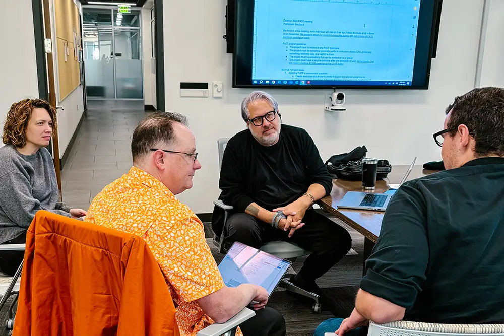 Four CATE members, award-winning teachers across the UT campus, gather together to discuss the Principles of Excellence in Teaching (PoET).